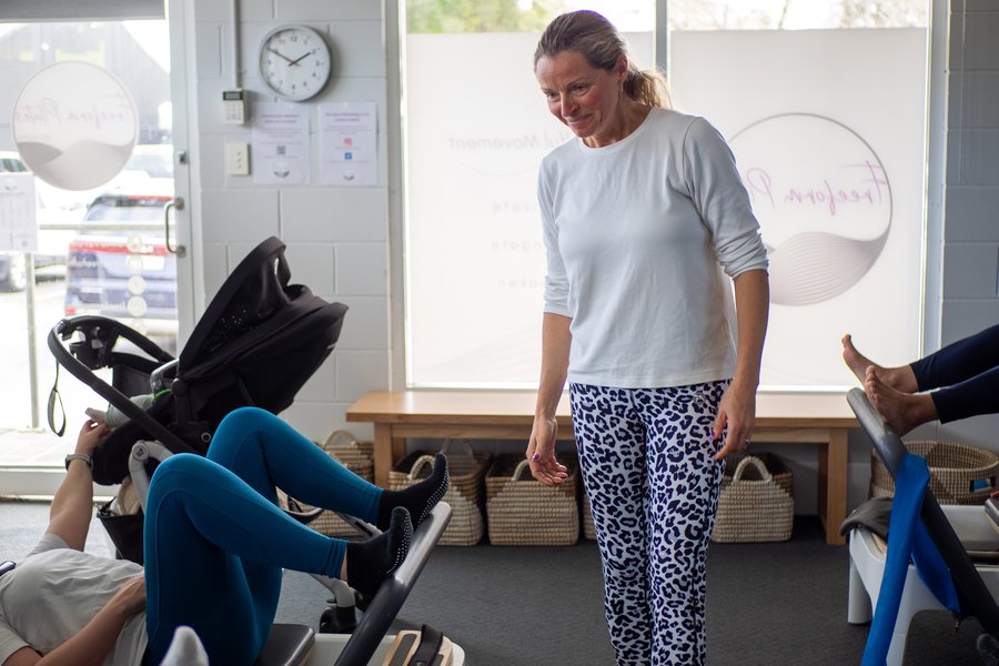 Jules Ott demonstrating Reformer Pilates
